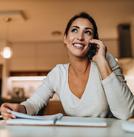 Woman smiling while talking on the phone